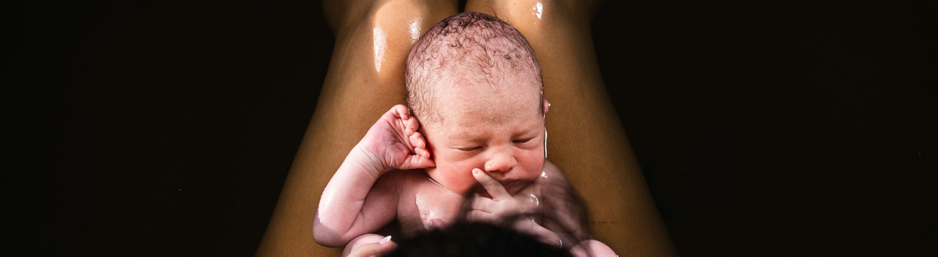 A newborn resting skin-to-skin moments after birth